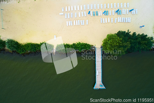 Image of Aerial view of a beach with sunbeds.