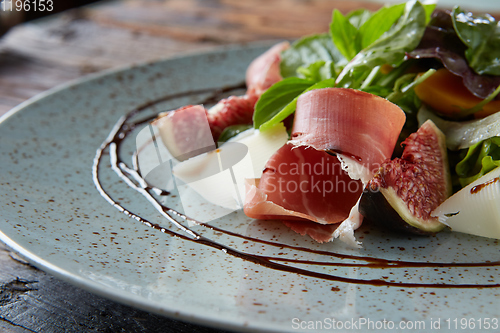 Image of Italian salad. From figs with jamon and parmesan.