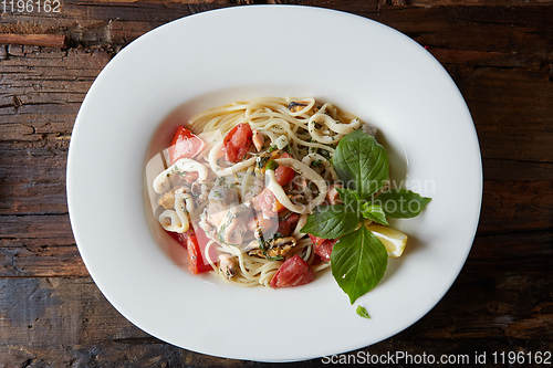 Image of Seafood pasta Spaghetti with Clams, Prawns, Seafood Cocktail close up