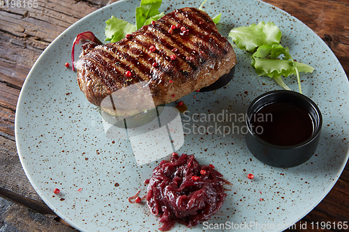 Image of The beef steak on plate. Shallow dof.