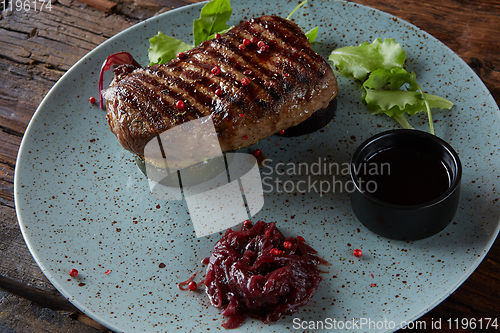 Image of The beef steak on plate. Shallow dof.