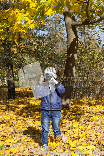 Image of little boy with a camera