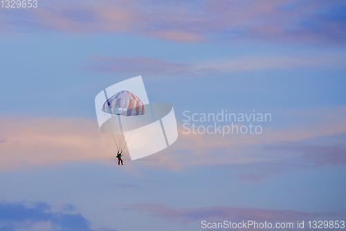 Image of parachuting sport in sunset sky