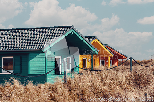 Image of colorful wooden tiny houses on the island