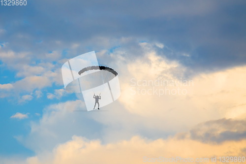 Image of parachuting sport in sunset sky