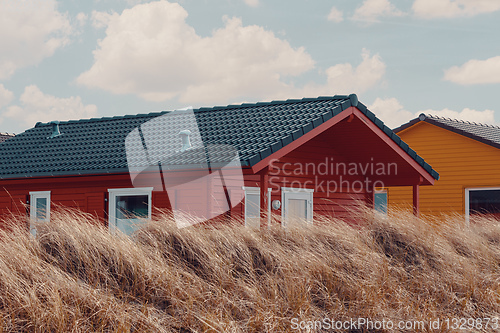 Image of colorful wooden tiny houses on the island