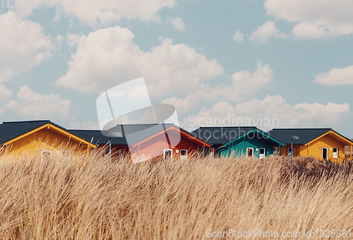 Image of colorful wooden tiny houses on the island