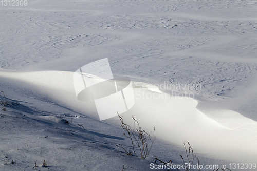 Image of uneven snowdrifts of snow