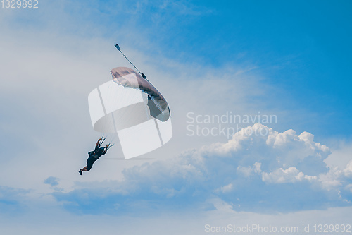 Image of parachuting sport in sunset sky