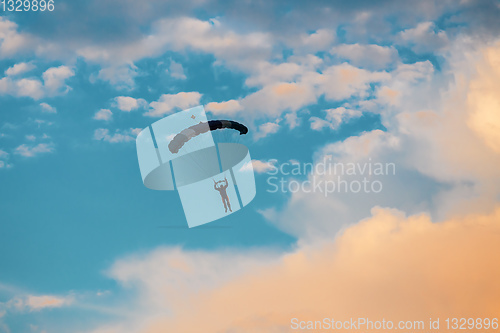 Image of parachuting sport in sunset sky