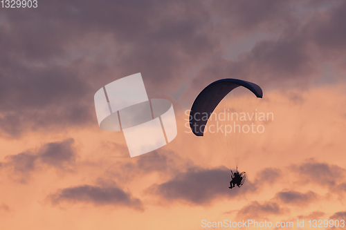 Image of parachuting sport in sunset sky