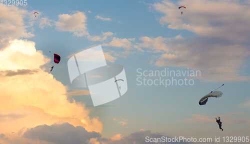 Image of parachuting sport in sunset sky