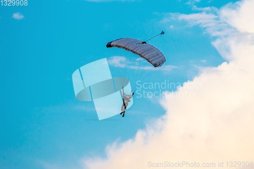 Image of parachuting sport in sunset sky