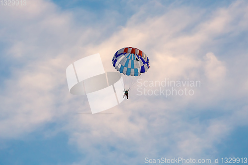 Image of parachuting sport in sunset sky