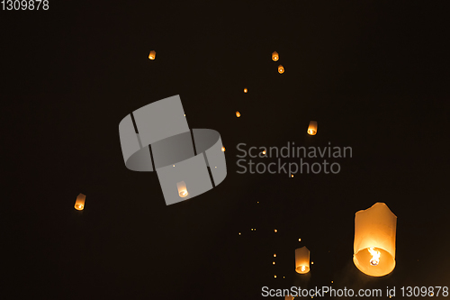 Image of Sky lanterns glowing in night