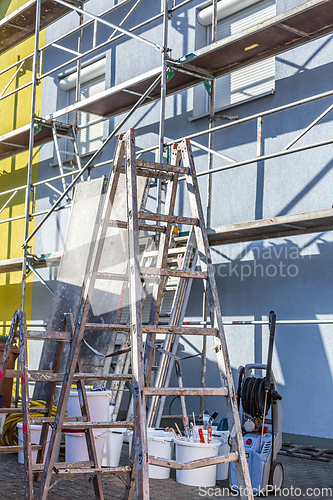 Image of Modern house under construction with scaffold pole platform. 