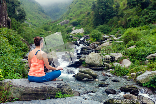 Image of Woman doing yoga outdoors