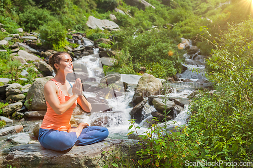 Image of Woman in Padmasana outdoors