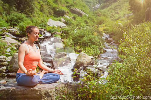 Image of Woman in Padmasana outdoors