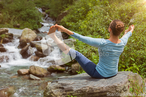 Image of Woman doing yoga outdoors