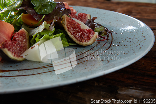 Image of Italian salad. From figs with jamon and parmesan.