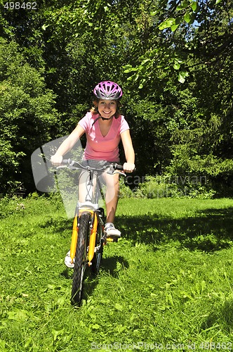 Image of Teenage girl on a bicycle