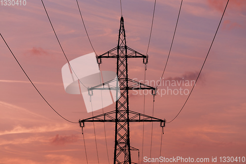 Image of summer sunset with electricity tower