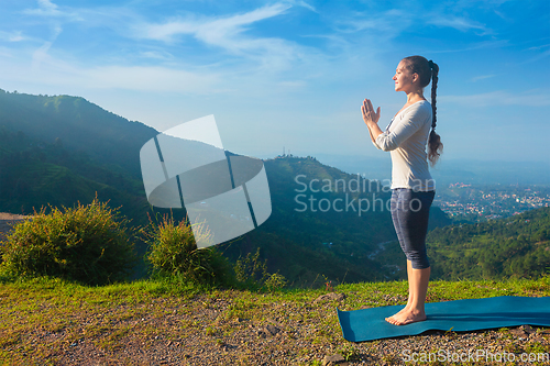 Image of Woman doing yoga in mountains