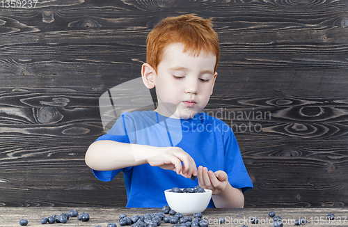 Image of blueberry and boy