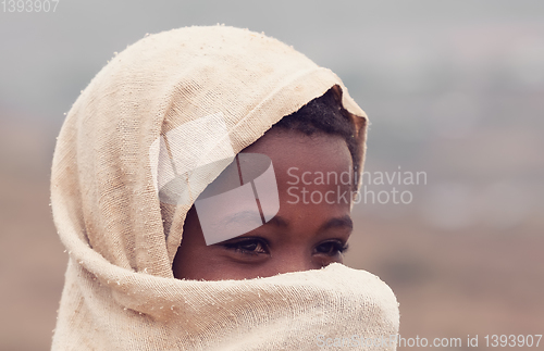 Image of Beautiful Ethiopian girl hiding her face