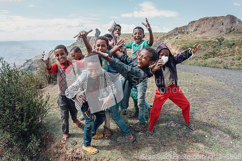 Image of Ethiopian teenager boys posing to tourists