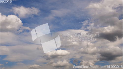 Image of Time lapse Fluffy clouds float across the blue sky. UltraHD stock footage