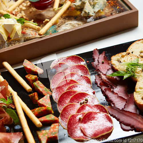 Image of Antipasto Platter Cold meat plate with grissini breadsticks.