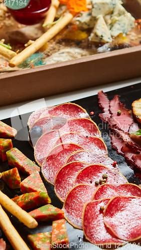 Image of Antipasto Platter Cold meat plate with grissini breadsticks.