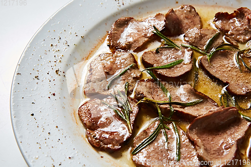 Image of Fried beef tongue with coarse salt. Grilled beef tongue.