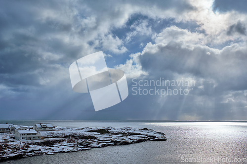 Image of Norwegian sea in winter with sun rays