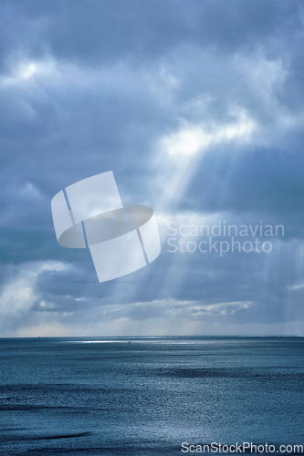 Image of Norwegian sea in winter with sun rays