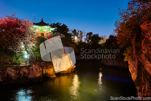 Image of Yongyeon Pond with Yongyeon Pavilion illuminated at night, Jeju islands, South Korea