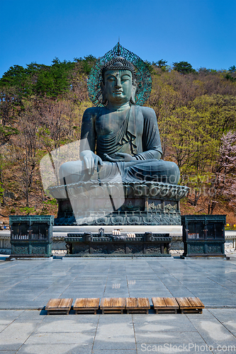 Image of The Great Unification Buddha Tongil Daebul statue in Seoraksan National Park, South Korea.