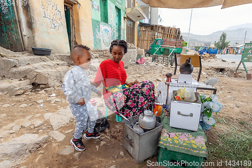 Image of beautiful women preparing bunna coffee, Ethiopia