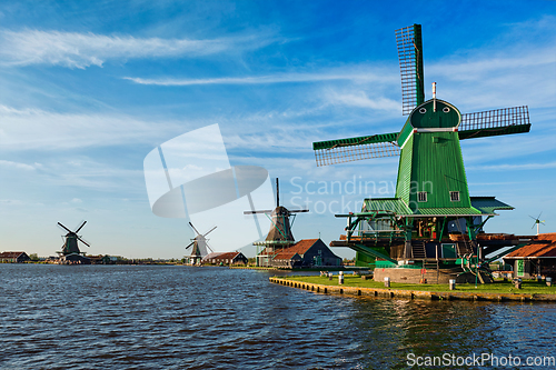 Image of Windmills at Zaanse Schans in Holland on sunset. Zaandam, Nether