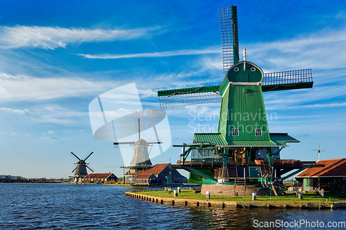 Image of Windmills at Zaanse Schans in Holland on sunset. Zaandam, Nether