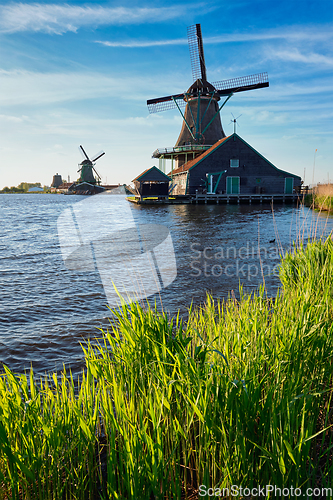 Image of Windmills at Zaanse Schans in Holland on sunset. Zaandam, Nether