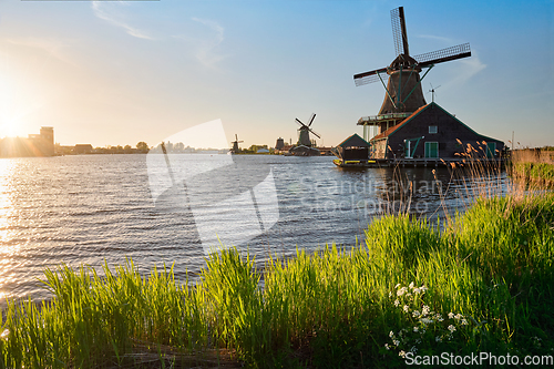 Image of Windmills at Zaanse Schans in Holland on sunset. Zaandam, Nether