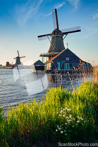 Image of Windmills at Zaanse Schans in Holland on sunset. Zaandam, Nether