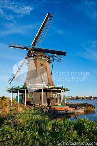 Image of Windmills at Zaanse Schans in Holland on sunset. Zaandam, Nether