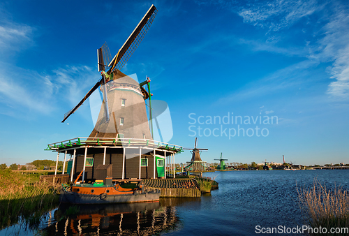 Image of Windmills at Zaanse Schans in Holland on sunset. Zaandam, Nether