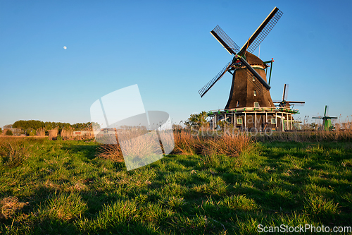 Image of Windmills at Zaanse Schans in Holland on sunset. Zaandam, Nether