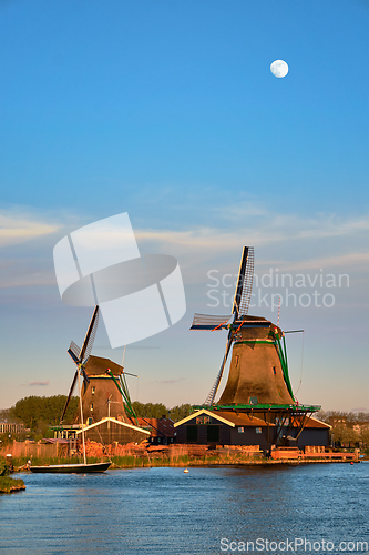 Image of Windmills at Zaanse Schans in Holland in twilight on sunset. Zaa