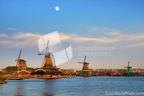 Image of Windmills at Zaanse Schans in Holland in twilight on sunset. Zaa